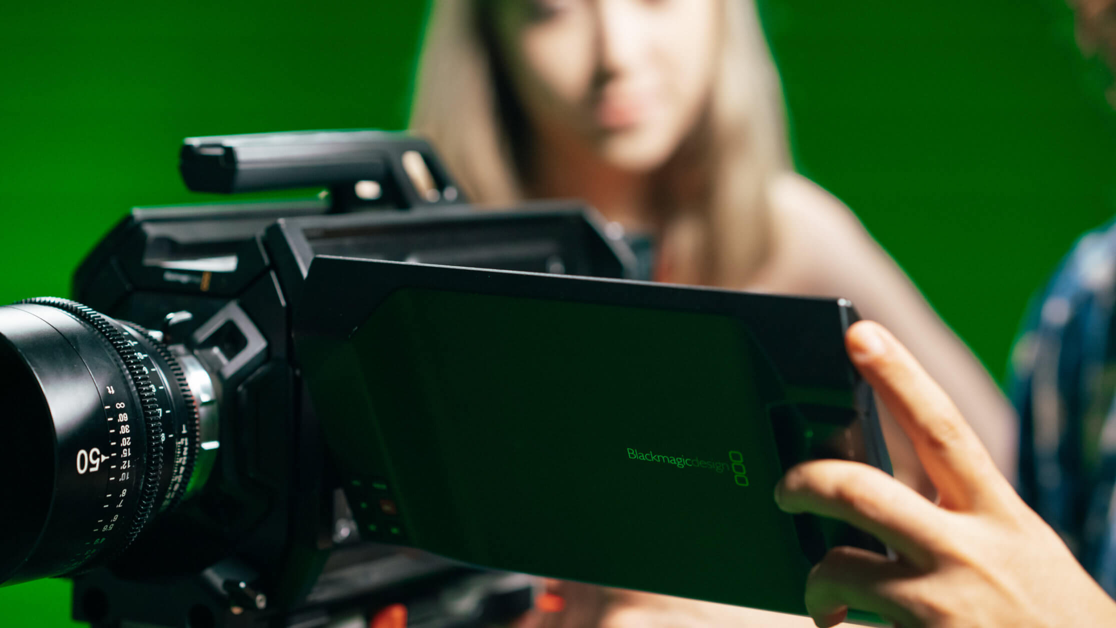 sae_liverpool-100 Woman using film equipment in film studio. Unleash your creativity with our Video Production course.