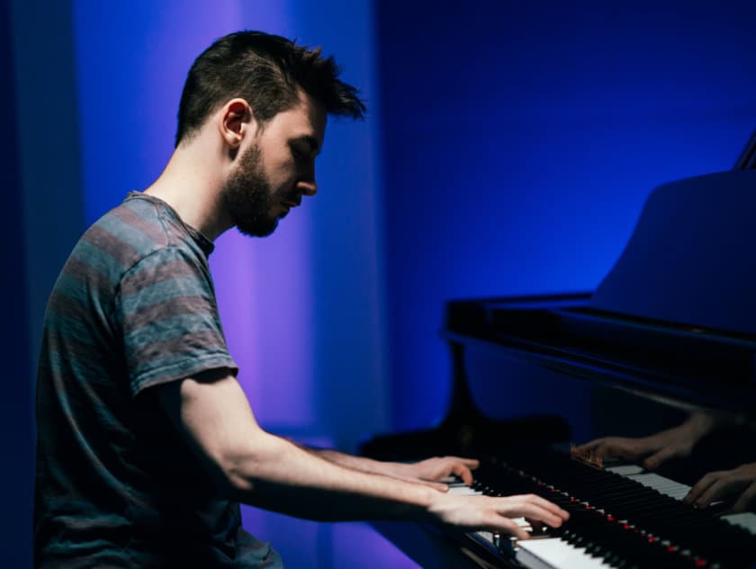 Musician playing piano SAE