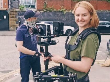 Student Operating Camera at SAE